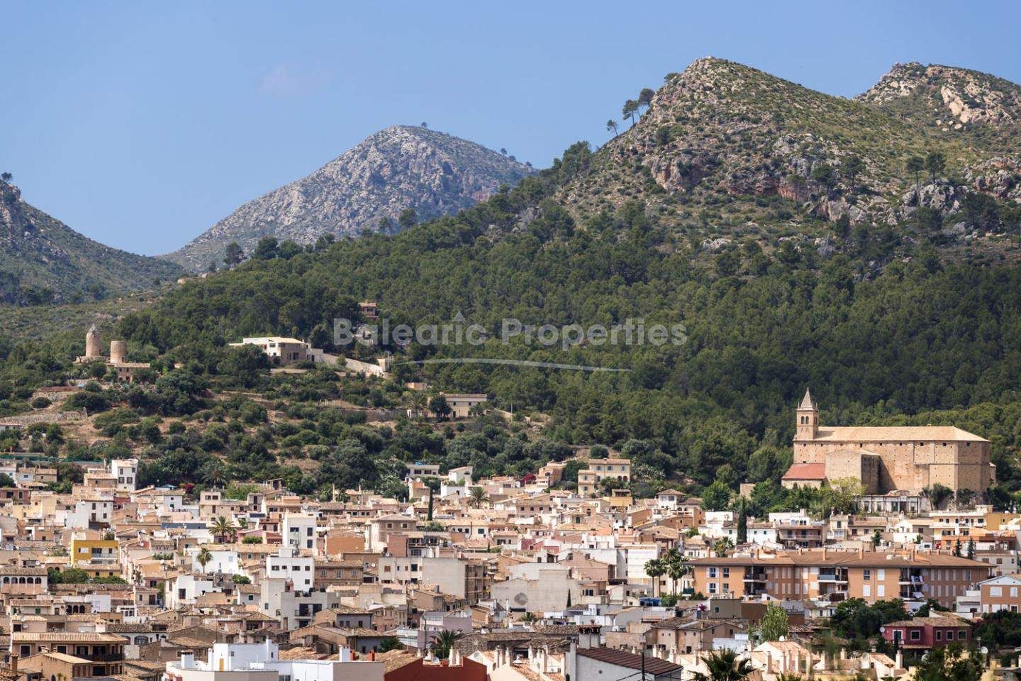 Picturesque view of Andratx town, Mallorca – historic charm and stunning mountain backdrop